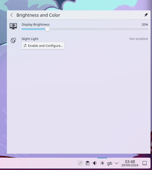 A screenshot of a KDE system tray showing a panel with a display brightness slider